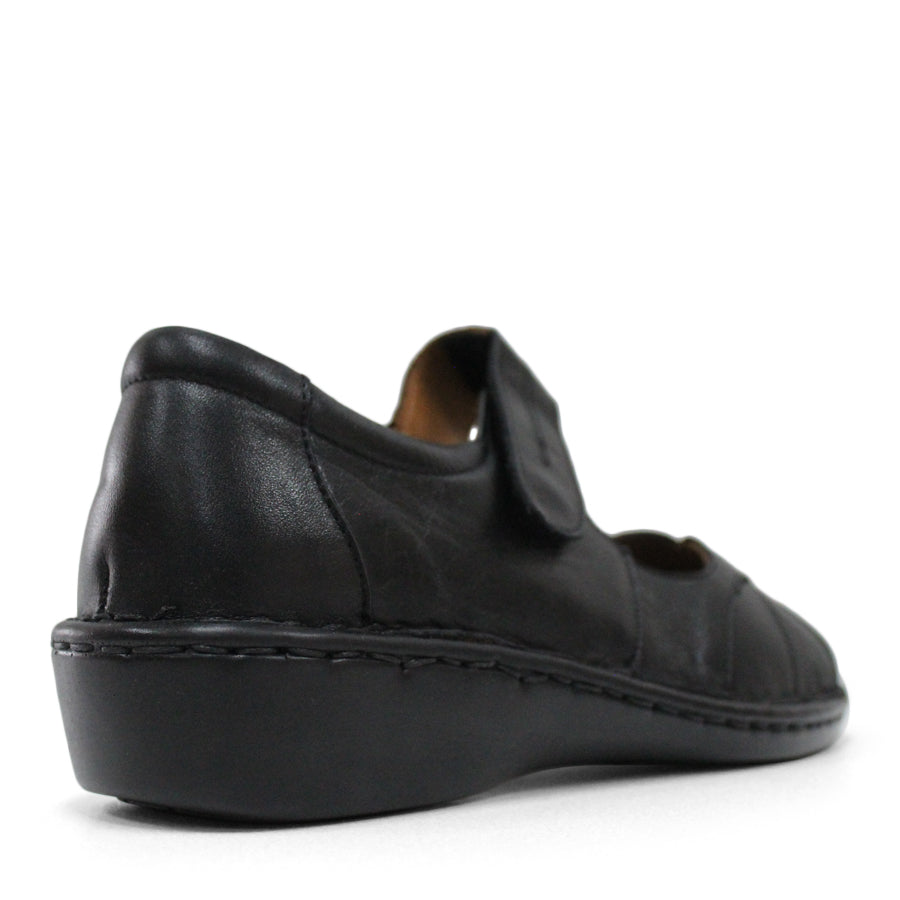 BACK VIEW OF BLACK LEATHER FLAT CASUAL SHOW WITH VELCRO CLOSURE