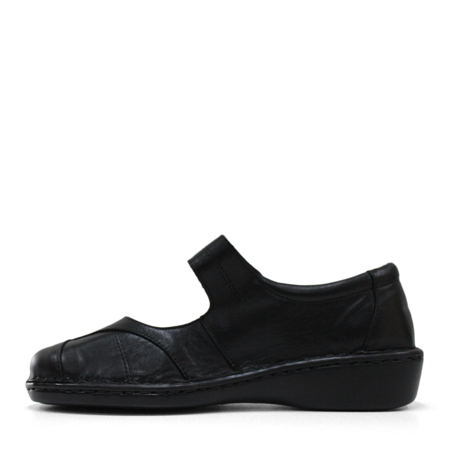 SIDE VIEW OF BLACK LEATHER FLAT CASUAL SHOW WITH VELCRO CLOSURE