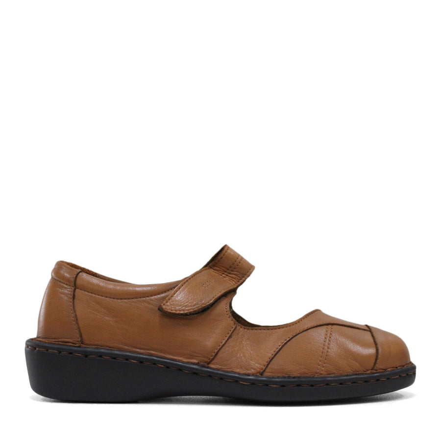 SIDE VIEW OF TAN LEATHER FLAT CASUAL SHOW WITH VELCRO CLOSURE