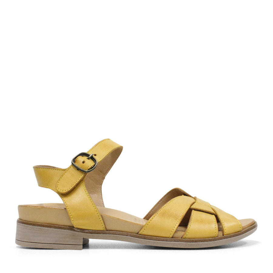 SIDE VIEW OF YELLOW LEATHER SANDAL WITH INTERWOVEN Y-BACK AND BUCKLE