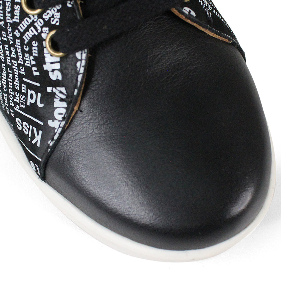 FRONT VIEW OF BLACK NEWSPAPER PRINT LACE UP SNEAKER WITH WHITE SOLE 