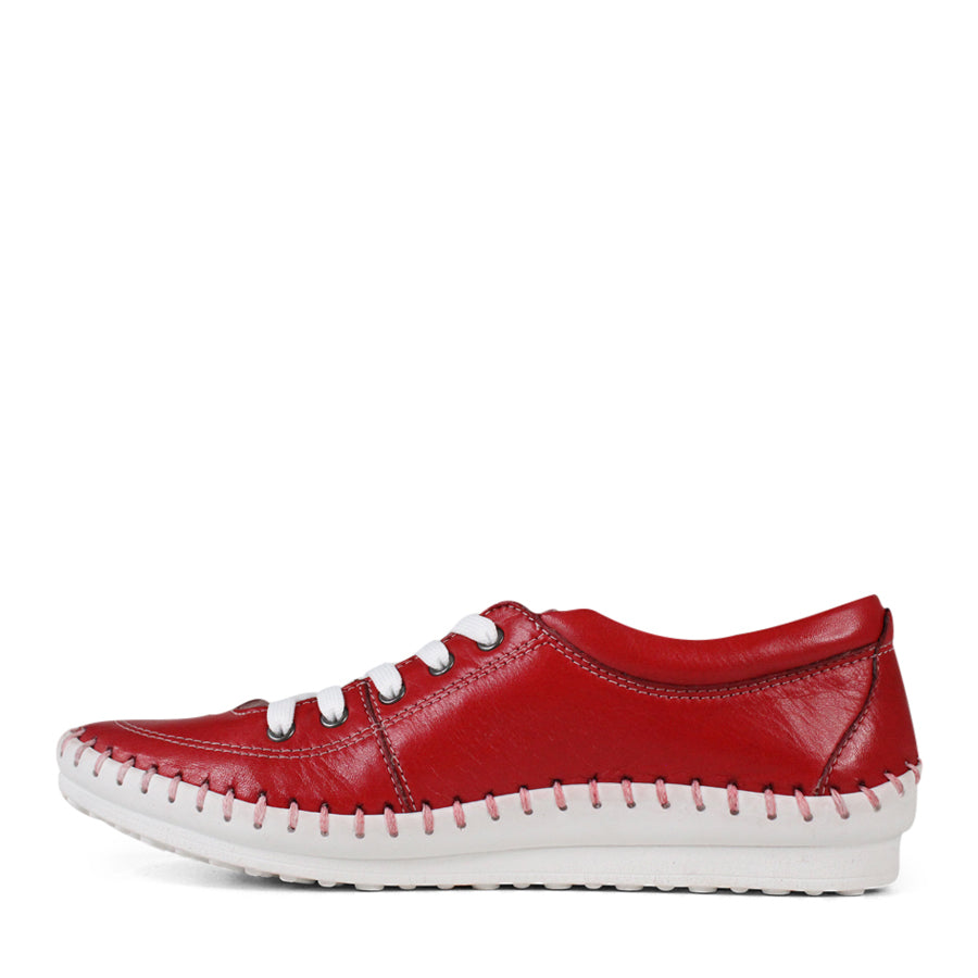 SIDE VIEW OF RED LACE UP CASUAL SHOE WITH WHITE STITCH DETAIL ACROSS THE TOP OF THE SOLE