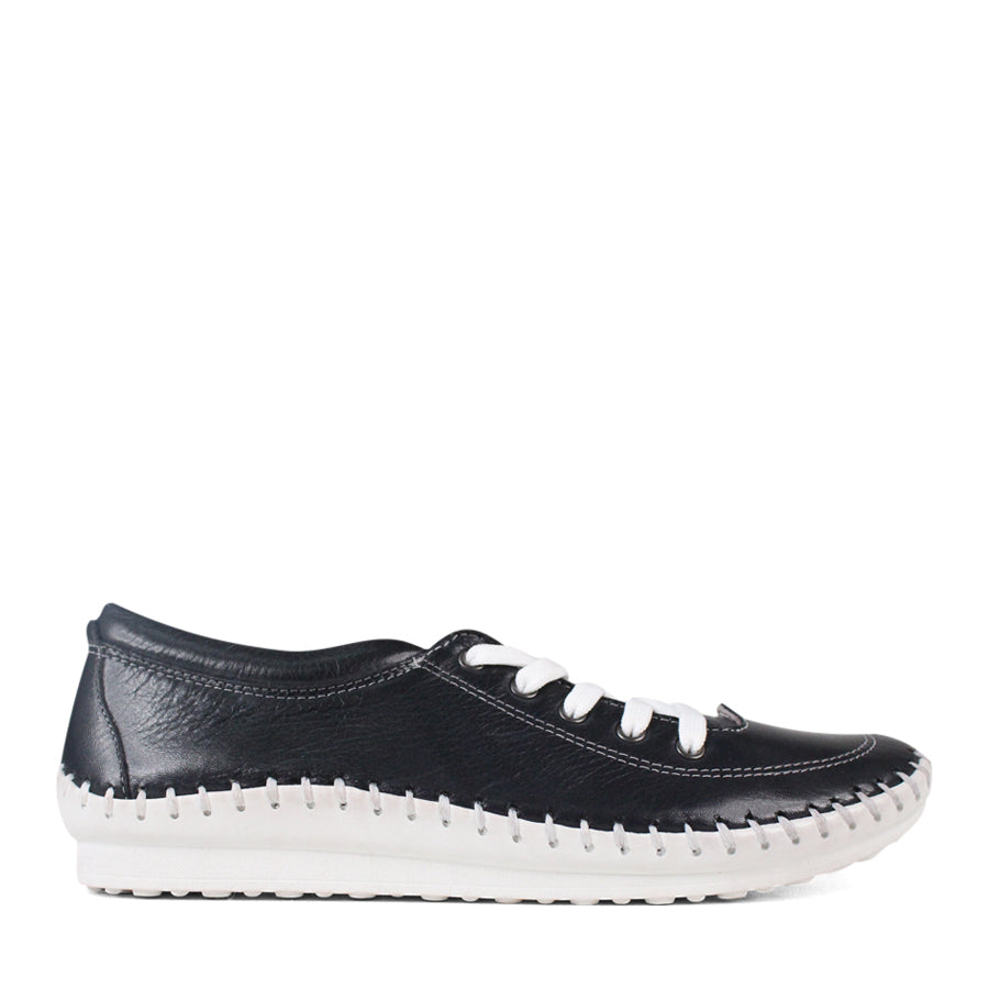 SIDE VIEW OF NAVY LACE UP CASUAL SHOE WITH WHITE STITCH DETAIL ACROSS THE TOP OF THE SOLE