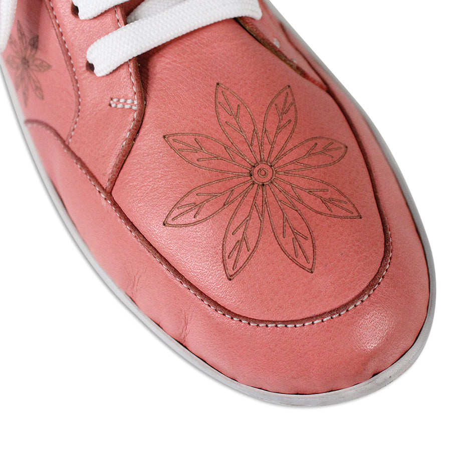 FRONT VIEW OF PINK LACE UP CASUAL SHOE WITH WHITE SOLE AND WHITE STITCHING. FLOWERS ON THE SIDES AND TOP OF THE SHOE 