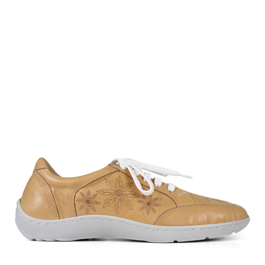  SIDE VIEW OF BEIGE LACE UP CASUAL SHOE WITH WHITE SOLE AND WHITE STITCHING. FLOWERS ON THE SIDES AND TOP OF THE SHOE 