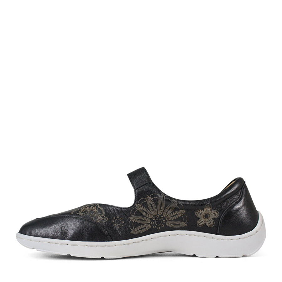 SIDE VIEW OF BLACK CASUAL SHOE WITH VELCRO STRAP AND WHITE SOLE. FLOWERS ON THE SIDES AND TOP OF THE SHOE 
