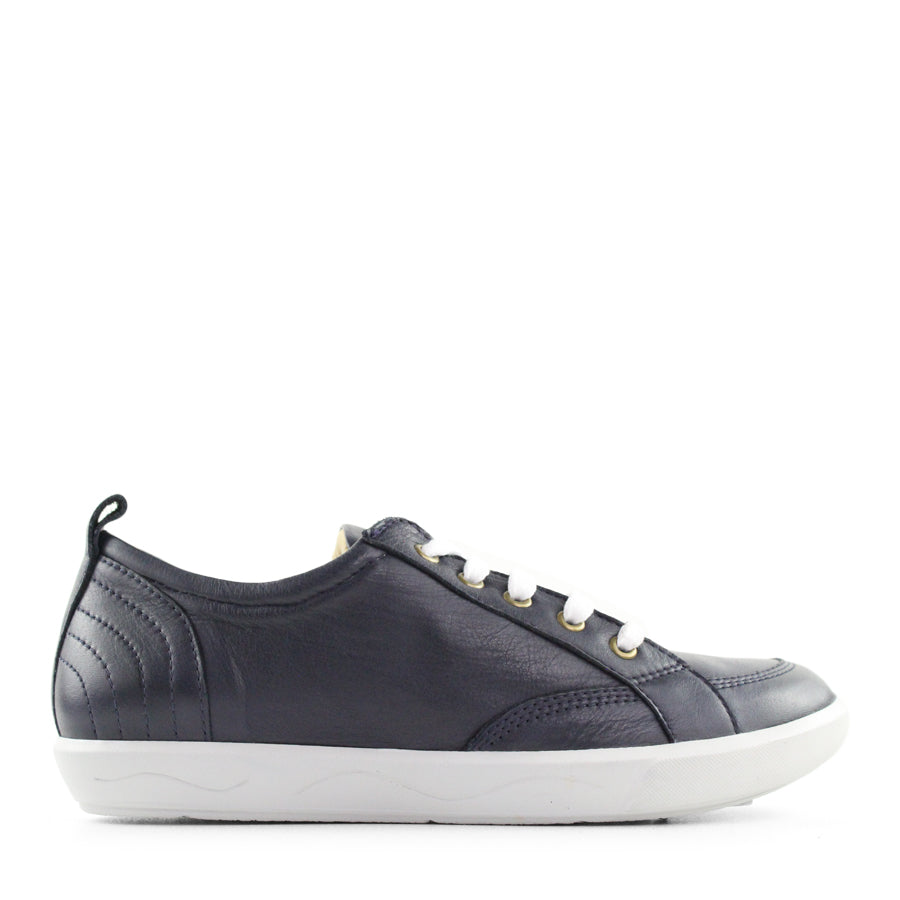 SIDE VIEW OF NAVY LACE UP SNEAKER WITH WHITE SOLE