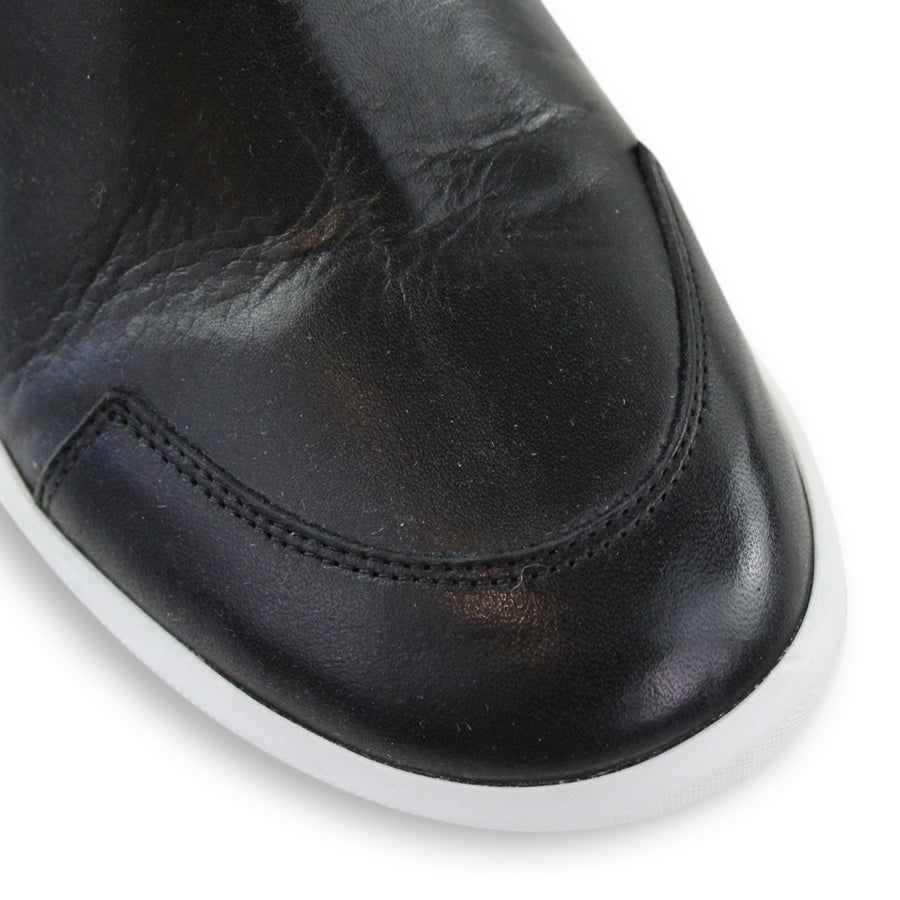 FRONT VIEW OF BLACK ZIP UP ANKLE BOOT WITH WHITE SOLE 