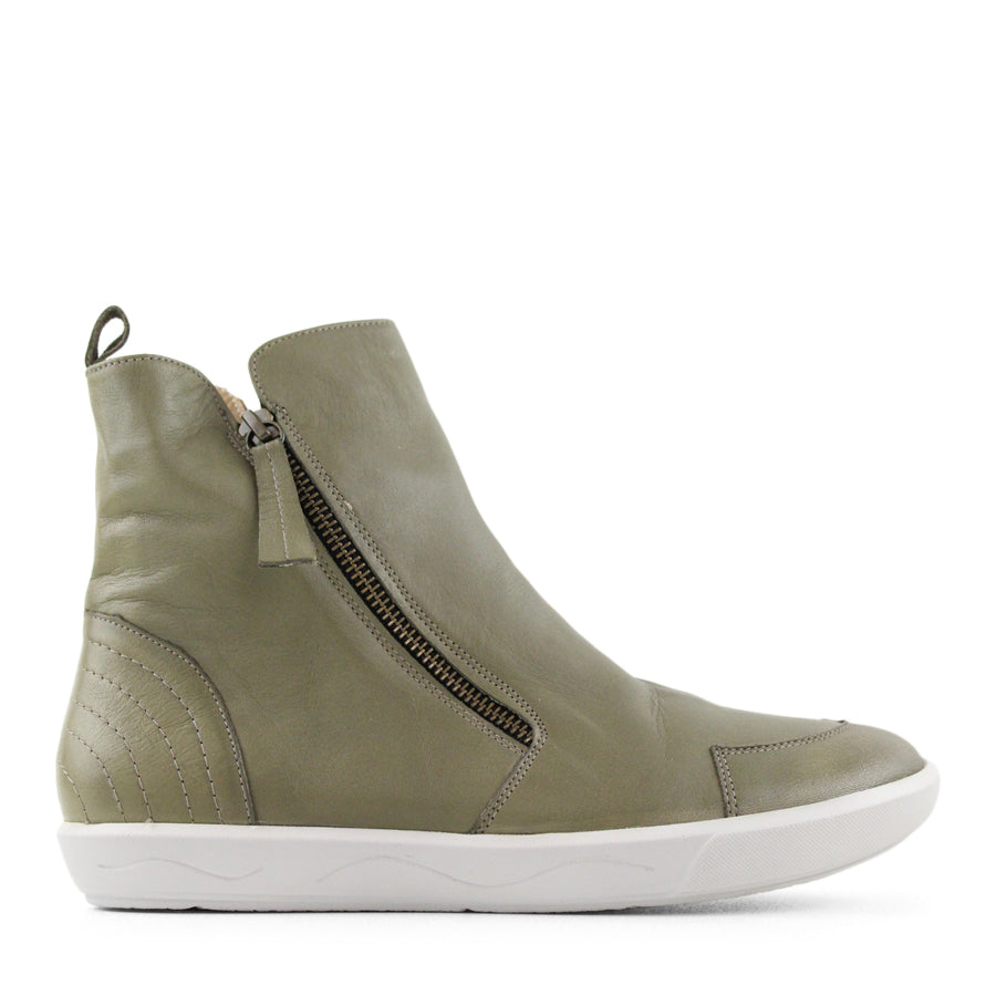 SIDE VIEW OF GREEN ZIP UP ANKLE BOOT WITH WHITE SOLE 