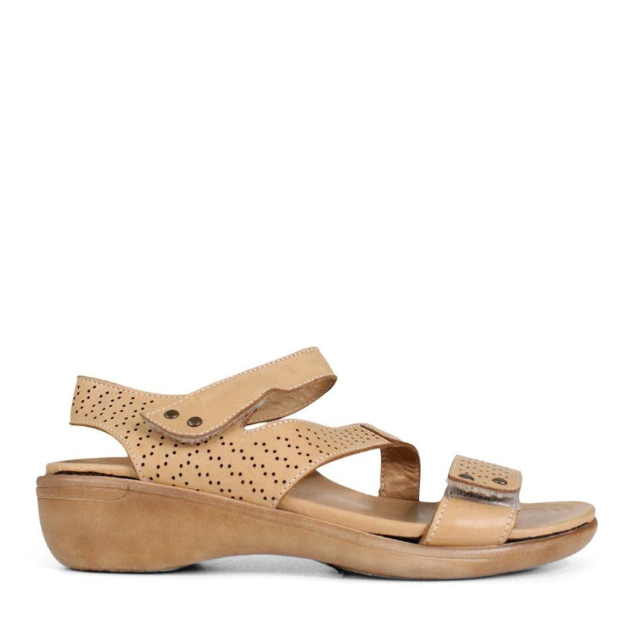 SIDE VIEW OF BEIGE SANDAL WITH 3 ADJUSTABLE STRAPS AND PERFORATED DETAILLING 