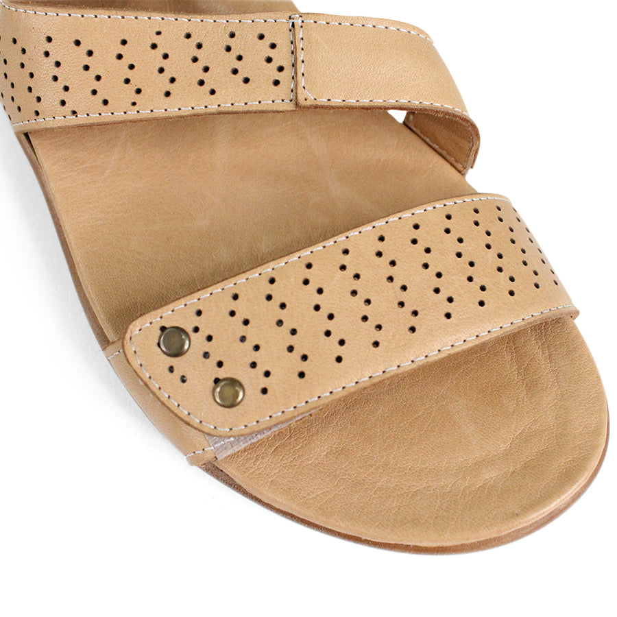 FRONT VIEW OF BEIGE SANDAL WITH 3 ADJUSTABLE STRAPS AND PERFORATED DETAILLING 