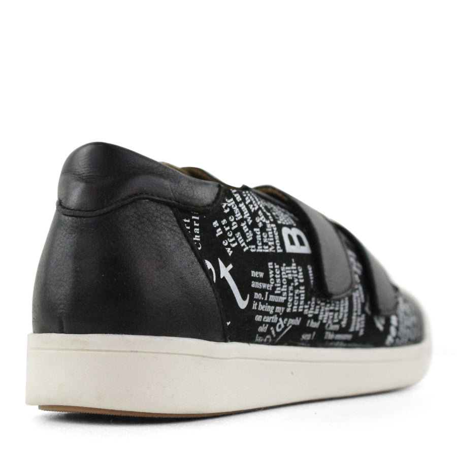 BACK VIEW OF BLACK NEWSPAPER PRINT SNEAKER WITH TWO VELCRO STRAPS AND WHITE SOLE  