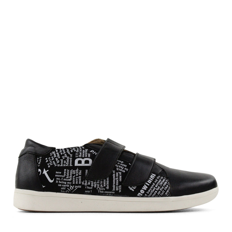 SIDE VIEW OF BLACK NEWSPAPER PRINT SNEAKER WITH TWO VELCRO STRAPS AND WHITE SOLE  