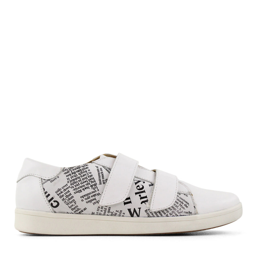 SIDE VIEW OF BLACK NEWSPAPER PRINT SNEAKER WITH TWO VELCRO STRAPS AND WHITE SOLE  
