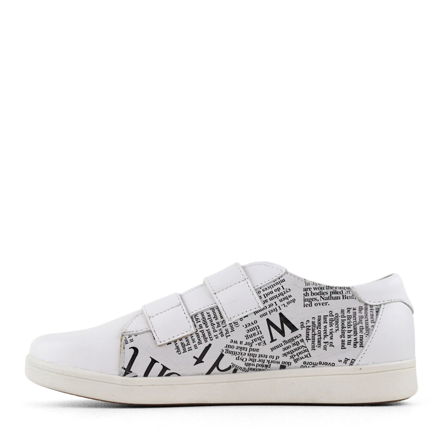 SIDE VIEW OF WHITE NEWSPAPER PRINT SNEAKER WITH TWO VELCRO STRAPS AND WHITE SOLE 