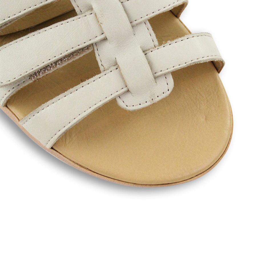 FRONT VIEW OF WHITE T BAR SANDAL WITH VELCRO STRAP AND SMALL HEEL 