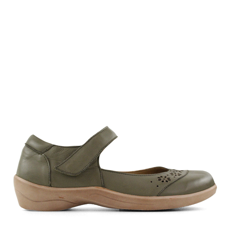 SIDE VIEW OF GREEN MARY JANE STYLE CASUAL SHOE WITH FLOWER CUT OUT DETAILLING ON THE TOP OF THE CLOSED TOE