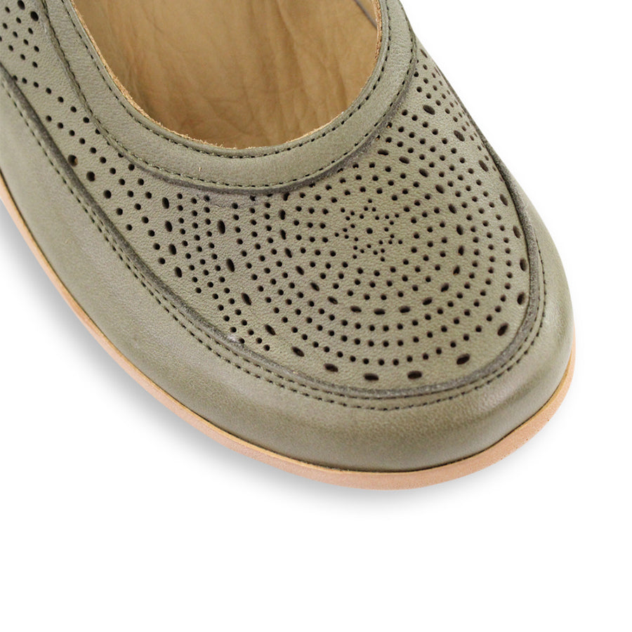 FRONT VIEW OF GREEN CASUAL SHOE WITH VELCRO STRAP AND LASER CUT DETAILING 
