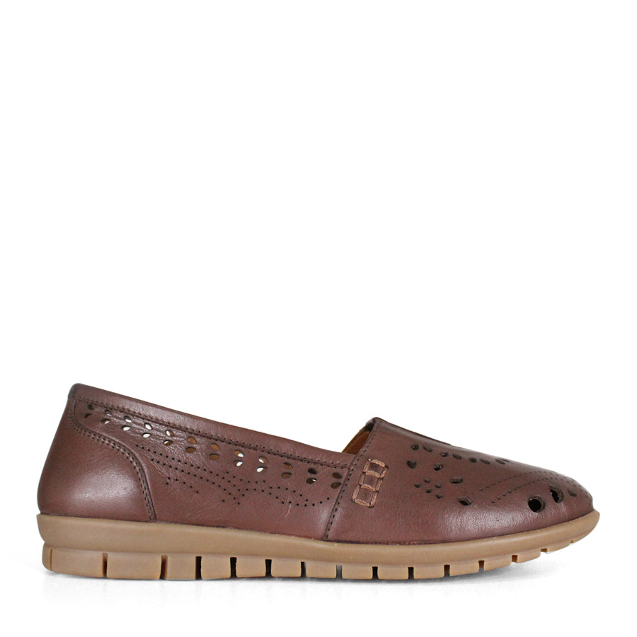 SIDE VIEW TAN FLAT CASUAL SHOE WITH CUT OUT DETAILING 