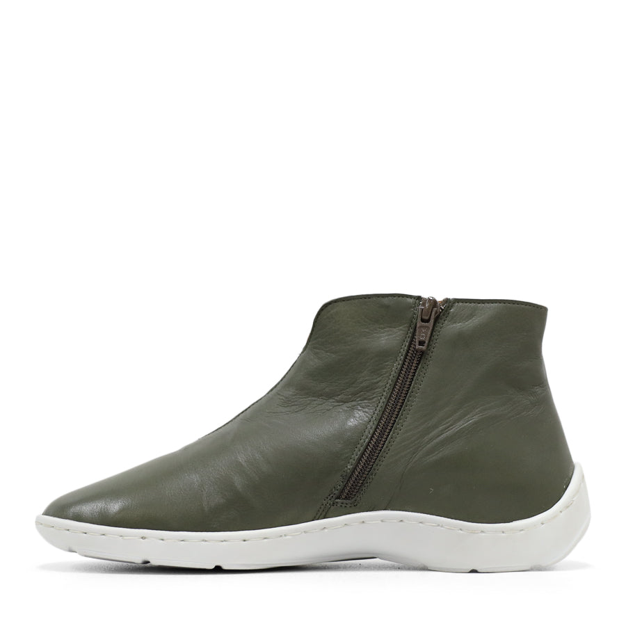 SIDE VIEW OF GREEN LEATHER ANKLE BOOT WITH WHITE SOLE AND PATTERNED DETAIL PANELLING 