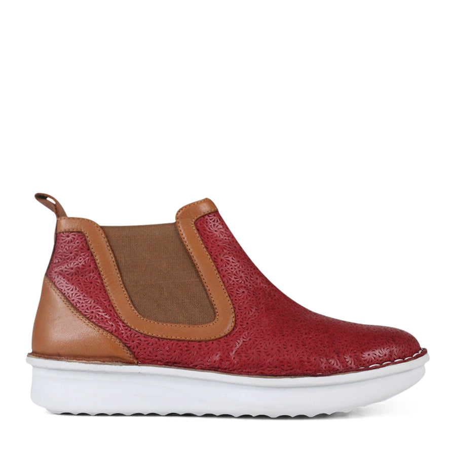 SIDE VIEW OF PATTERNED RED ANKLE BOOT WITH TAN PANELS AND WHITE SOLE 