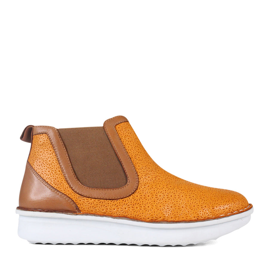 SIDE VIEW OF PATTERNED YELLOW ANKLE BOOT WITH TAN PANELS AND WHITE SOLE 