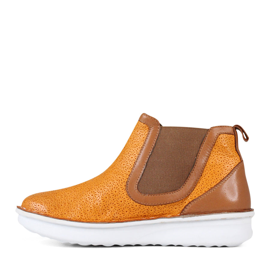 SIDE VIEW OF PATTERNED YELLOW ANKLE BOOT WITH TAN PANELS AND WHITE SOLE 