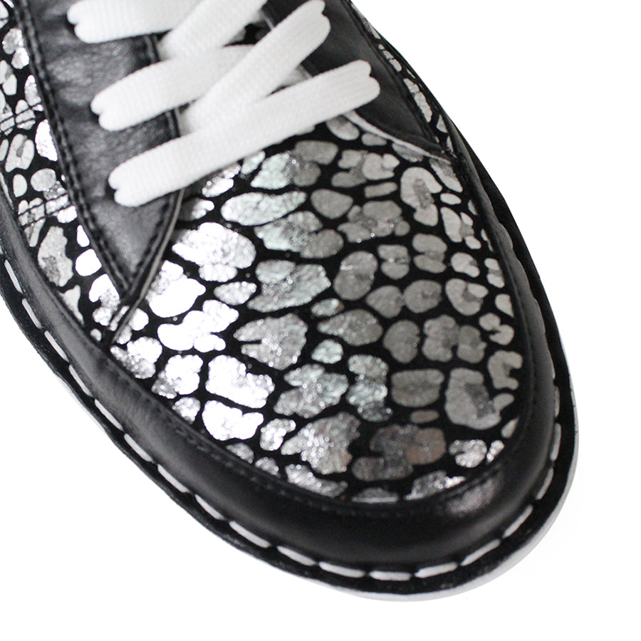 FRONT VIEW OF BLACK LACE UP SNEAKER WITH METALLIC LEOPARD PRINT DETAILING ON SIDE AND FRONT PANELS. WHITE SOLE 