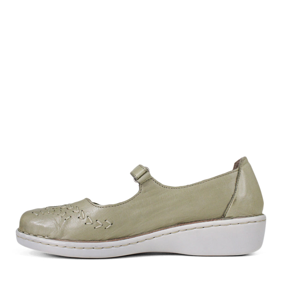 SIDE VIEW OF LIGHT GREEN LEATHER CASUAL SHOE WITH VELCRO STRAP AND WHITE STITCHING DETAIL