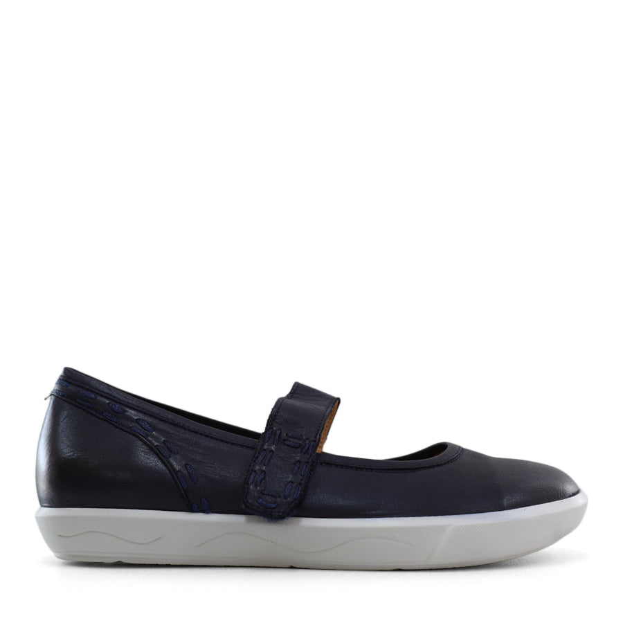 SIDE VIEW OF NAVY CASUAL SHOE WITH MARY JANE STYLE STRAP ACROSS THE TOP