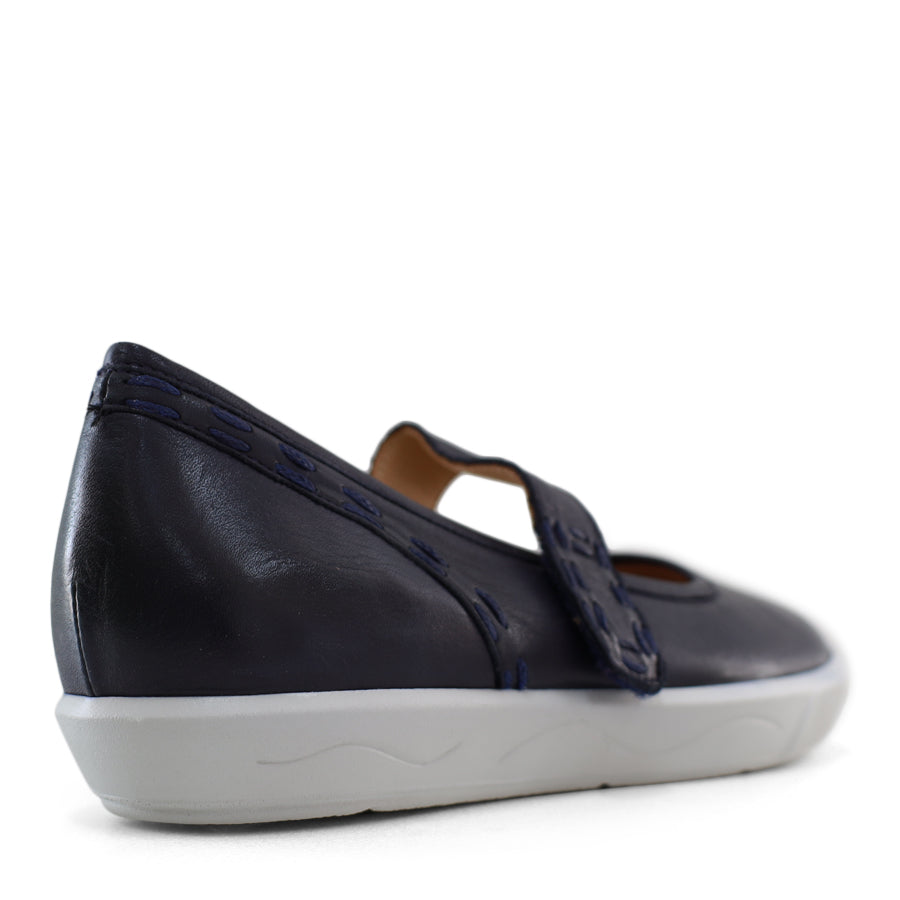 BACK VIEW OF NAVY CASUAL SHOE WITH MARY JANE STYLE STRAP ACROSS THE TOP