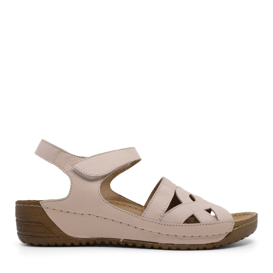 SIDE VIEW OF BLACK WEDGES WITH SMALL HEEL AND ADJUSTABLE VELCRO STRAP