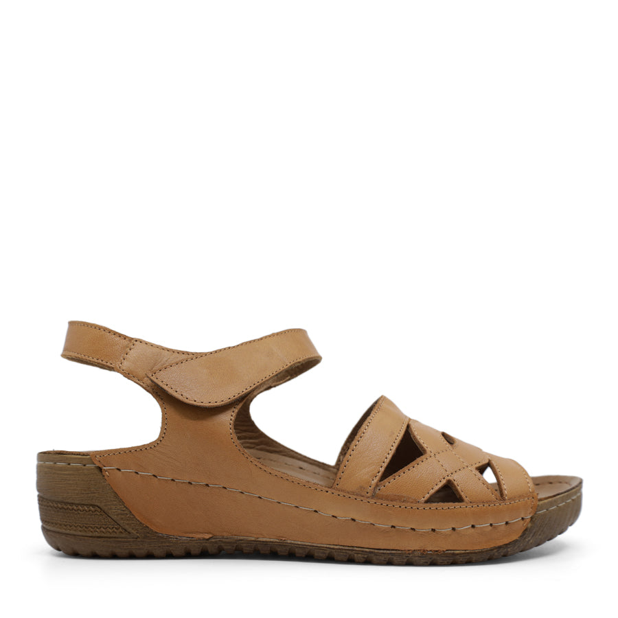 SIDE VIEW OF TAN WEDGES WITH SMALL HEEL AND ADJUSTABLE VELCRO STRAP