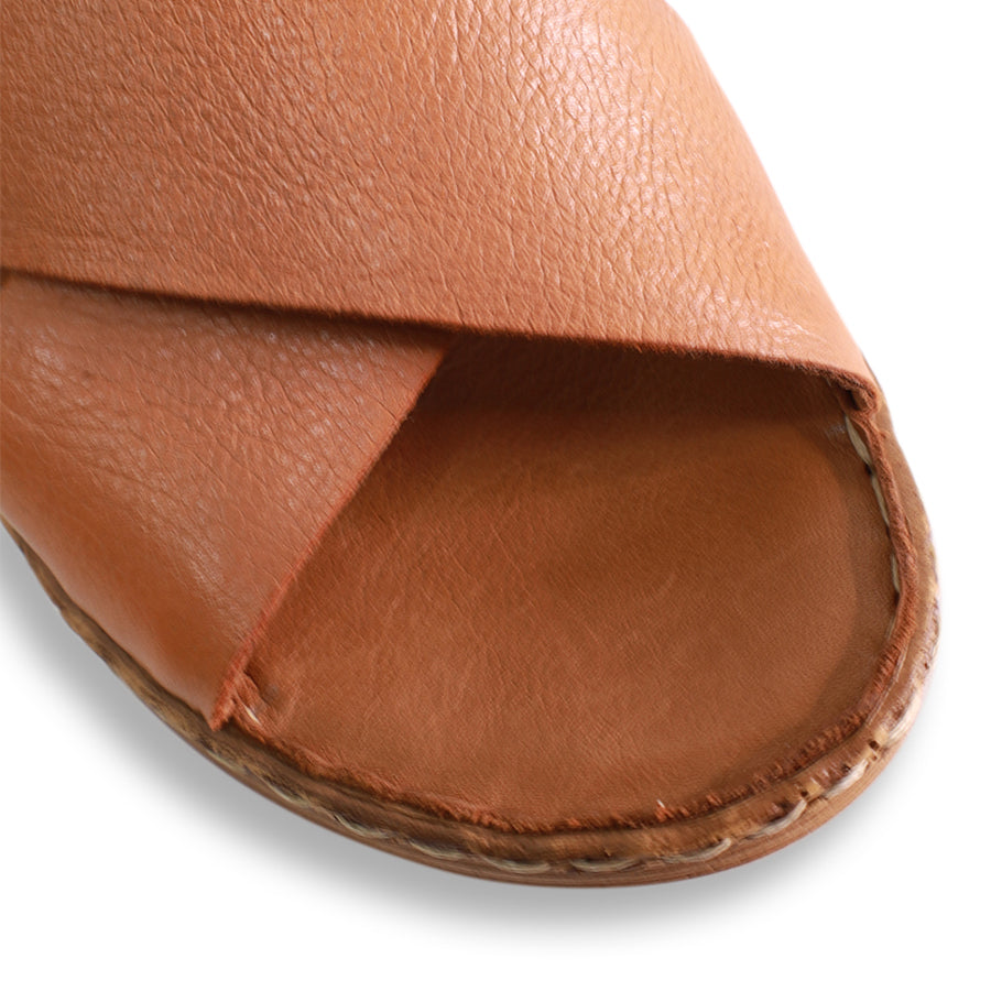 FRONT VIEW OF TAN LEATHER SANDAL WITH CRISS CROSS DETAIL  