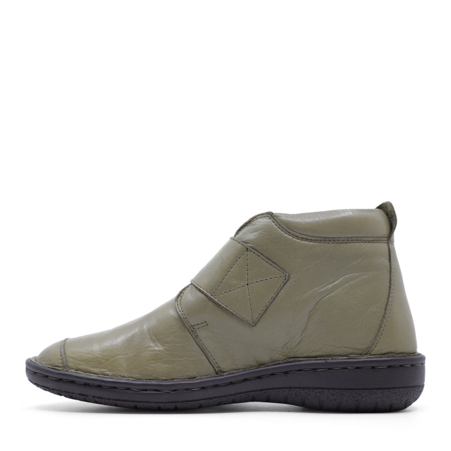 SIDE VIEW OF GREEN LEATHER ANKLE BOOT WITH STRAP