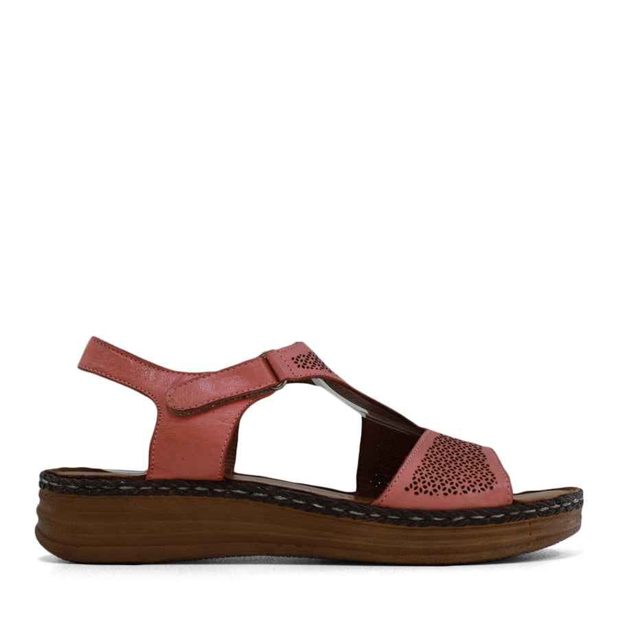  SIDE VIEW OF PINK LEATHER SANDAL WITH STRAP