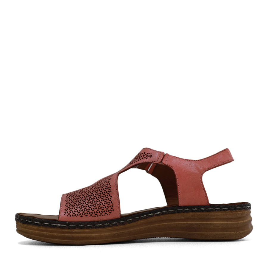 SIDE VIEW OF PINK LEATHER SANDAL WITH STRAP