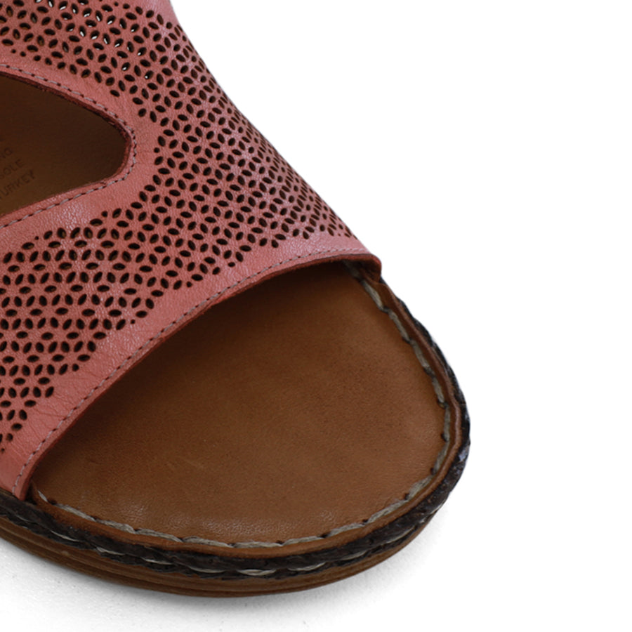 FRONT VIEW OF PINK LEATHER SANDAL WITH LASER CUT DETAILING AND OPEN TOE