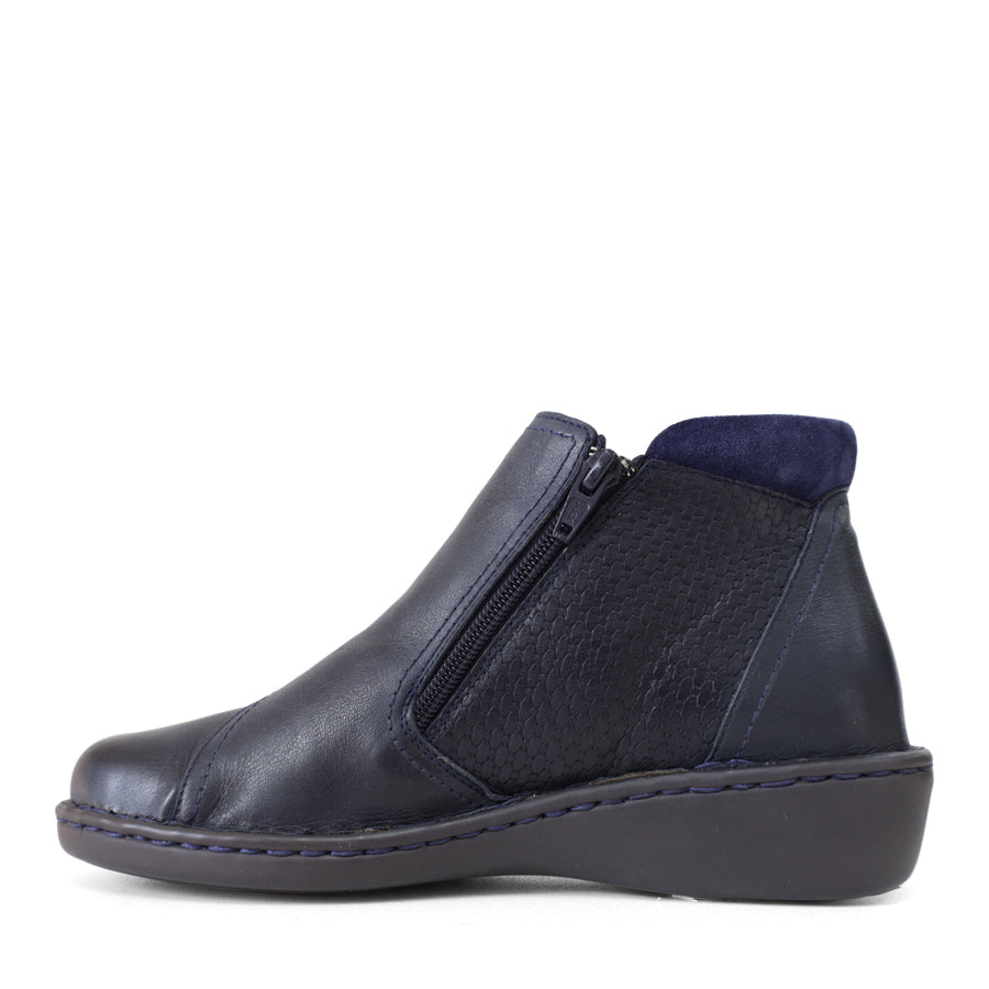 SIDE VIEW OF NAVY LEATHER ANKLE BOOT WITH ZIP