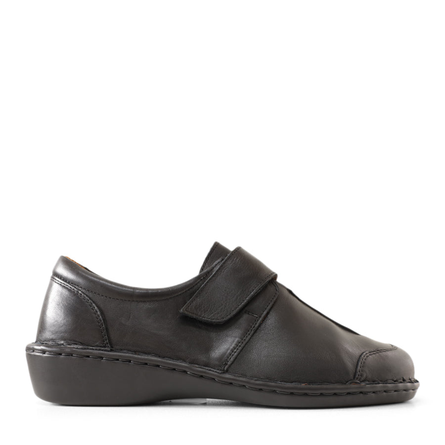SIDE VIEW OF BLACK LEATHER CASUAL SHOE WITH VELCRO STRAP 