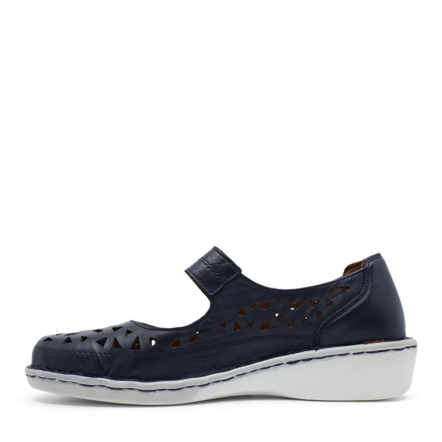 SIDE VIEW OF NAVY LEATHER CASUAL SHOE WITH VELCRO STRAP AND WHITE SOLE