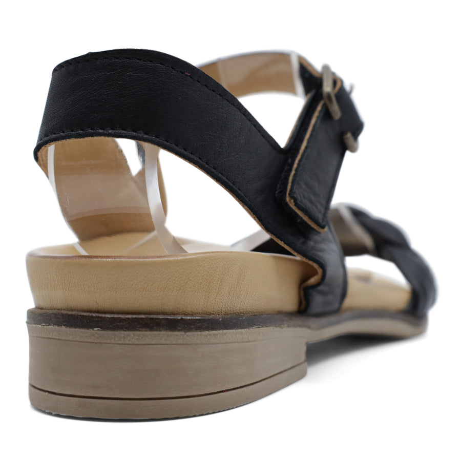 BACK VIEW OF BLACK LEATHER STRAP SANDAL. FRONT STRAP INTERWOVEN PLAITED LEATHER. VELCRO ADJUSTABLE Y BACK WITH DECORATIVE BUCKLE
