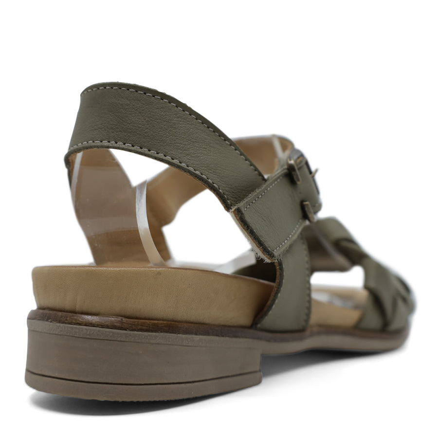 BACK VIEW OF GREEN LEATHER STRAP SANDAL. FRONT STRAP INTERWOVEN PLAITED LEATHER. VELCRO ADJUSTABLE Y BACK WITH DECORATIVE BUCKLE