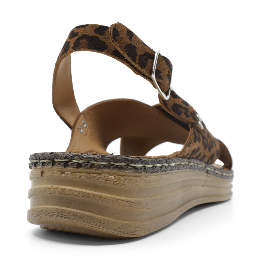 BACK VIEW OF LEOPARD LEATHER CRISS CROSS FRONT SANDAL WITH ADJUSTABLE BUCKLE AND CUSHIONED SOLE