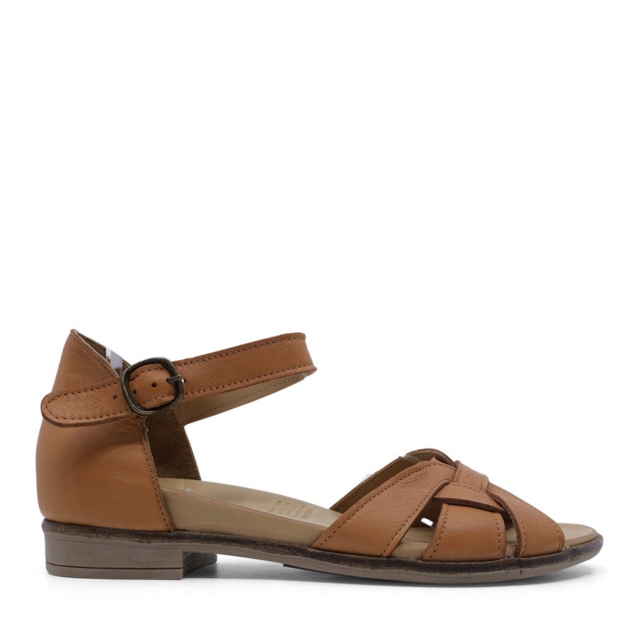 SIDE VIEW OF TAN LEATHER SANDAL WITH INTERWOVEN POCKED BACK FRONT AND ADJUSTABLE BUCKLE