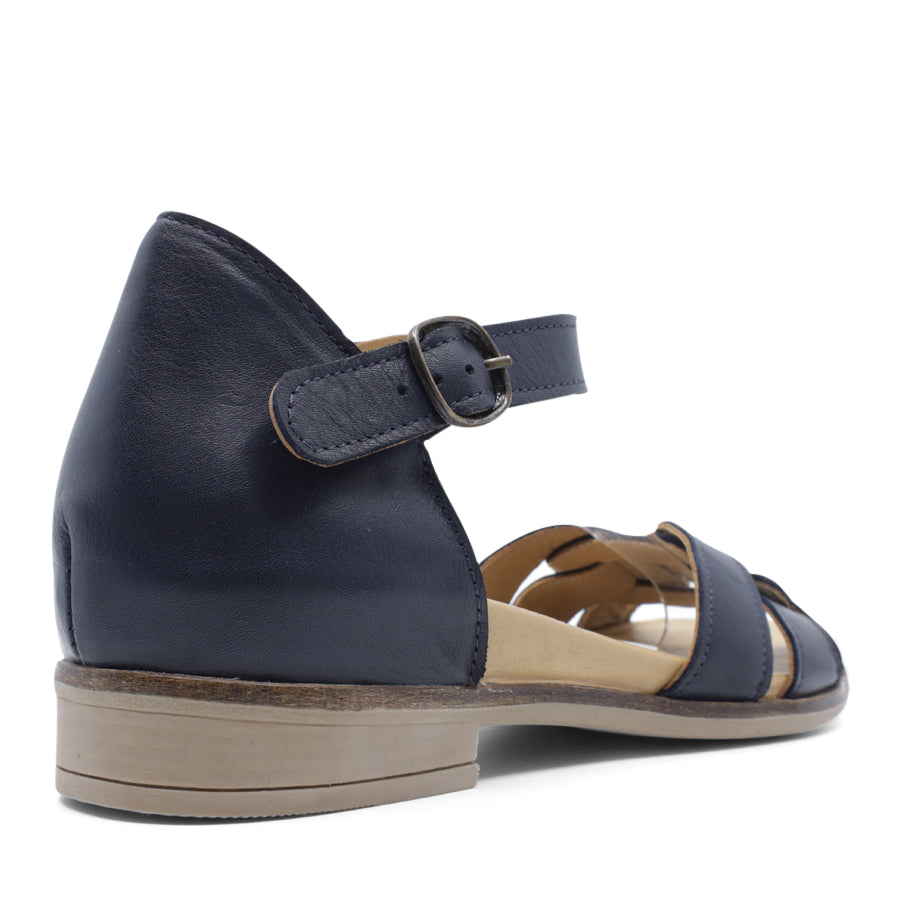 BACK VIEW OF NAVY LEATHER SANDAL WITH INTERWOVEN POCKED BACK FRONT AND ADJUSTABLE BUCKLE