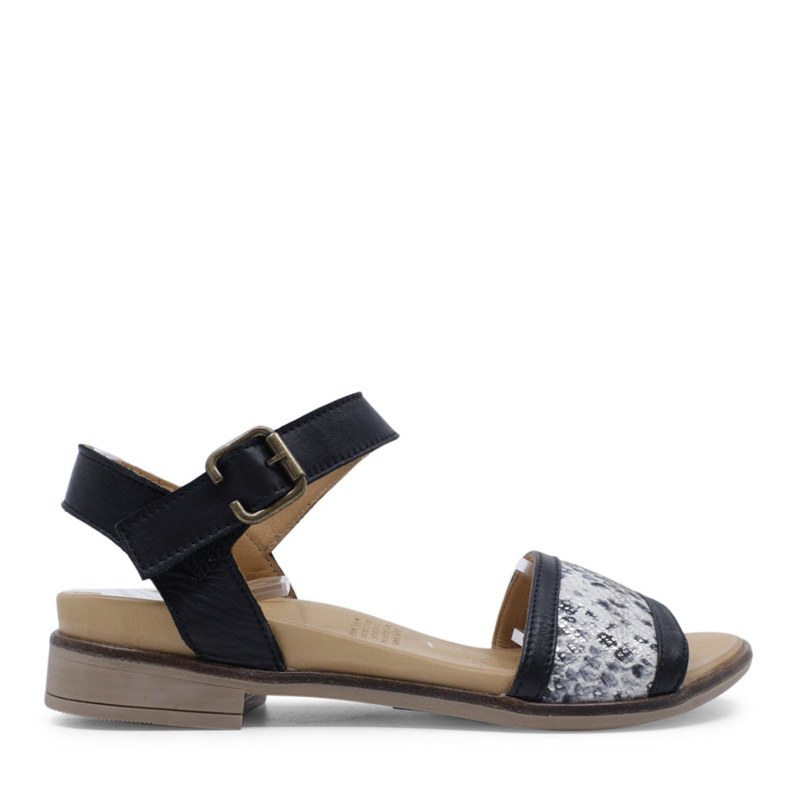 SIDE VIEW OF BLACK LEATHER SANDAL WITH SNAKE PRINT DETAIL AND ADJUSTABLE BUCKLE