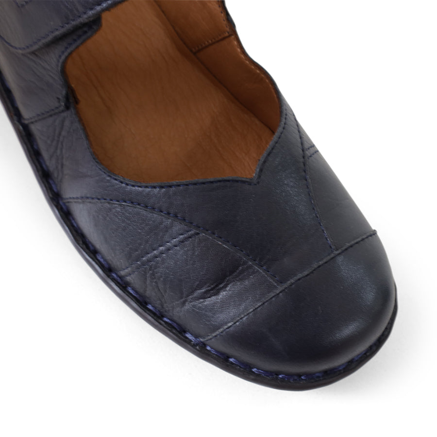FRONT VIEW OF BLUE LEATHER FLAT CASUAL SHOW WITH VELCRO CLOSURE