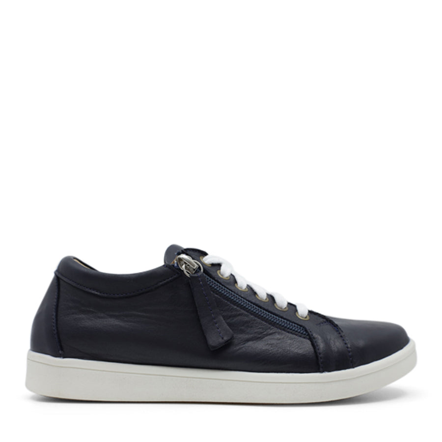 SIDE VIEW OF NAVY LACE UP SNEAKER WITH SIDE ZIP AND WHITE SOLE 