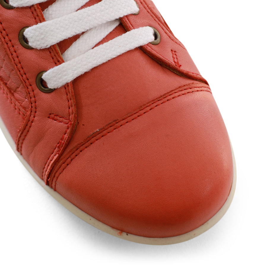 FRONT VIEW OF RED LACE UP SNEAKER WITH WHITE SOLE